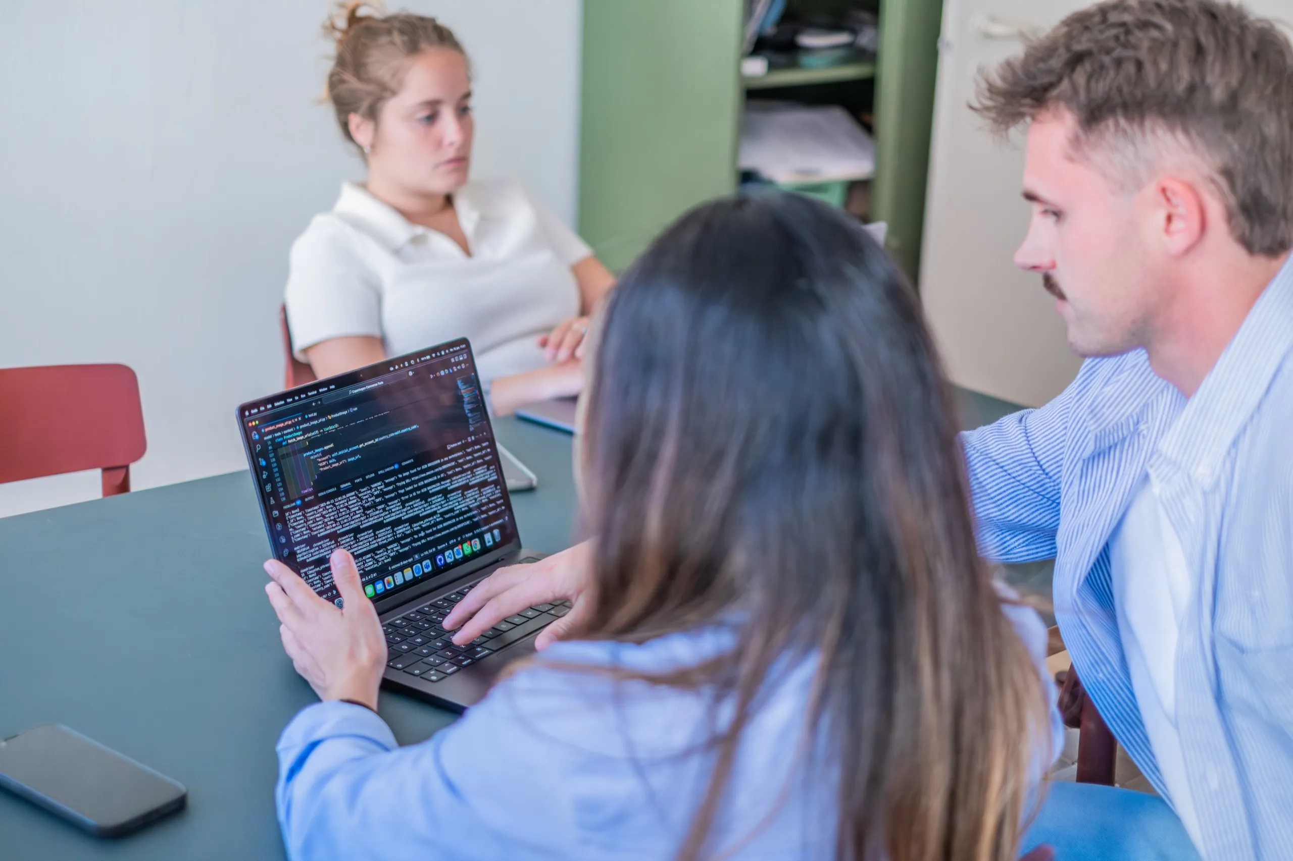 The team working through a project at the office