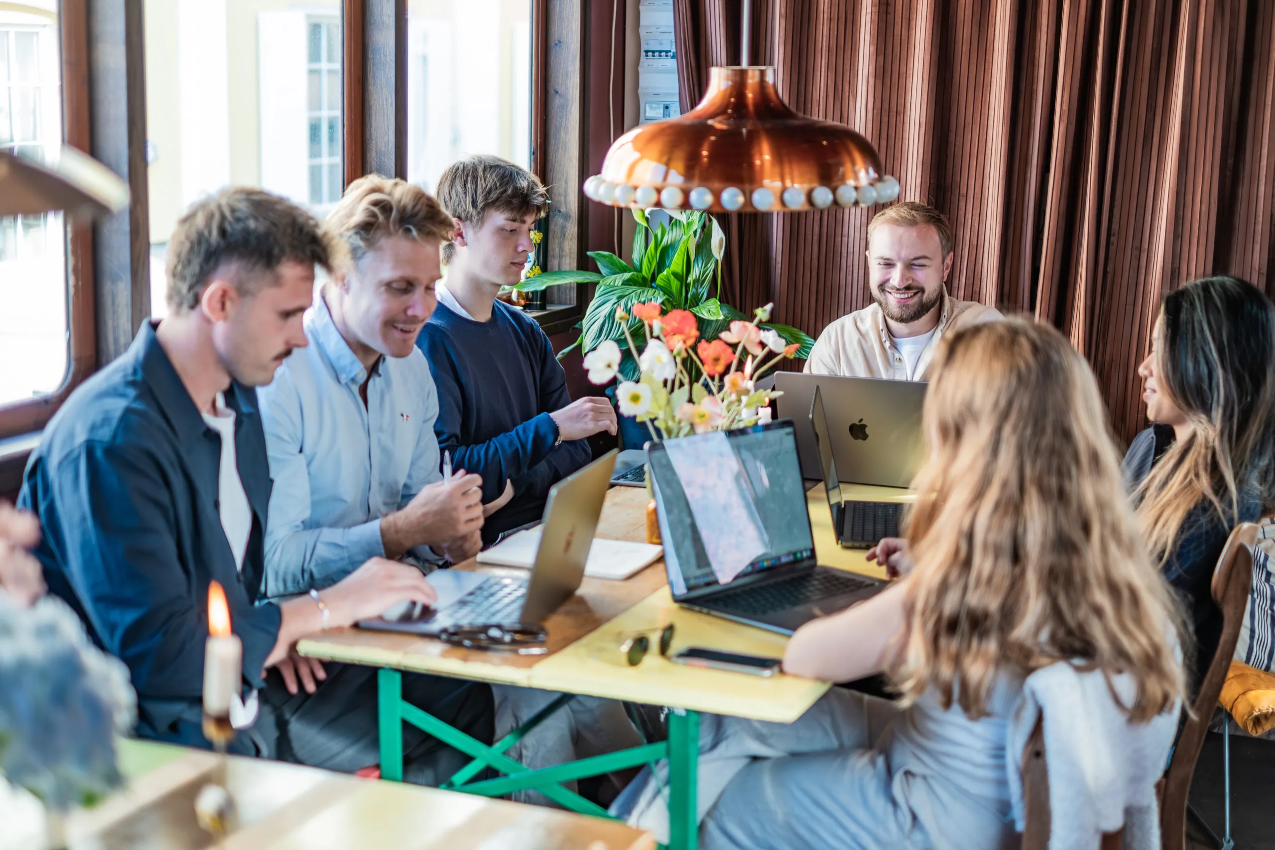The team working together at a Copenhagen café