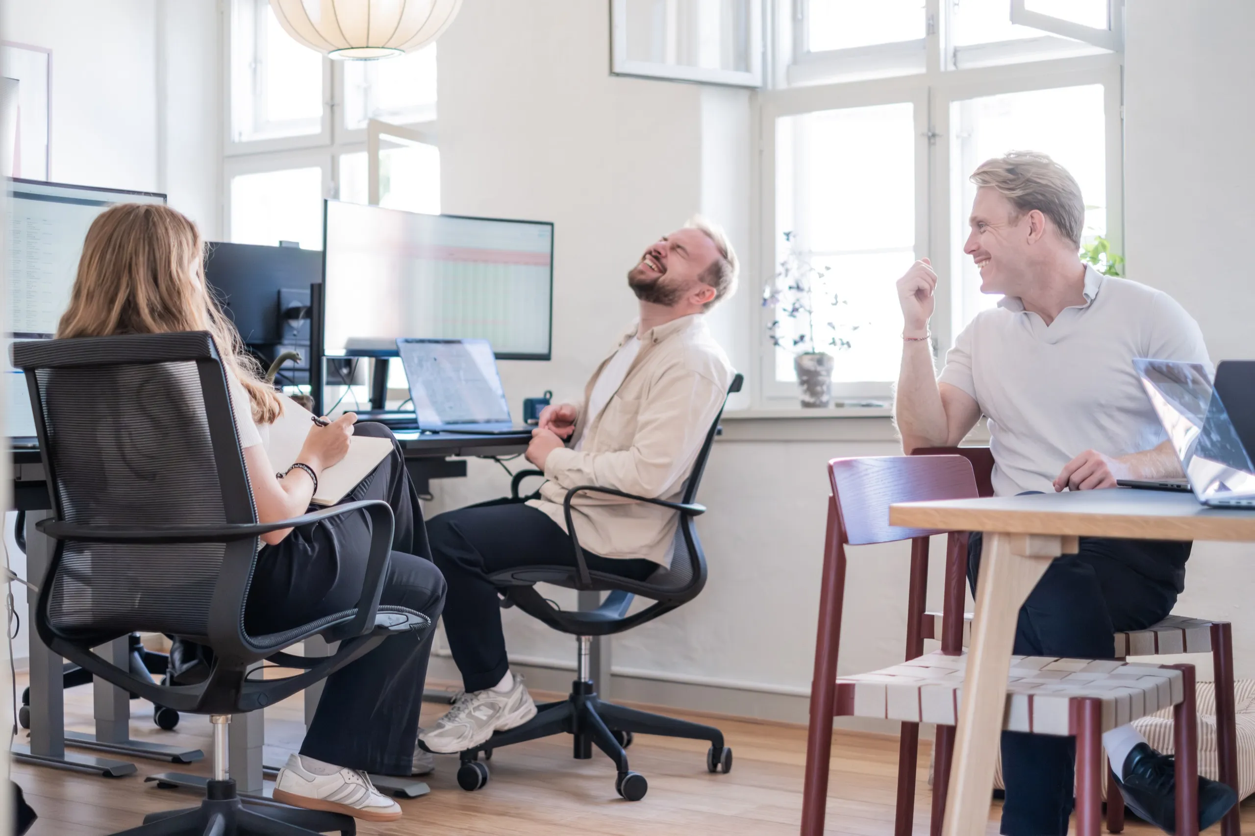 The team smiling in the office
